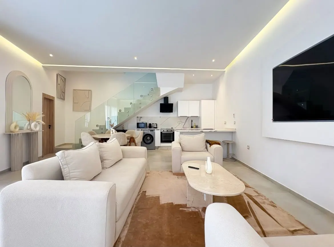 Pièce de vie ouverte d'un appartement géré par Get Host